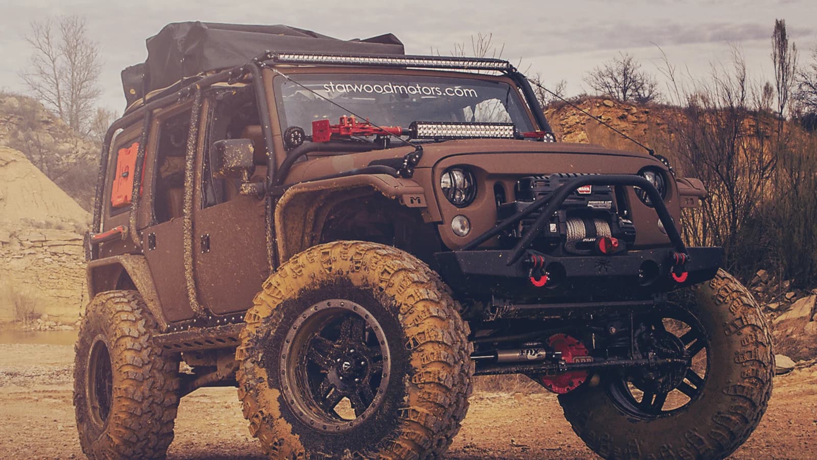 A customized Starwood Motors Jeep Wrangler photographed on open ground